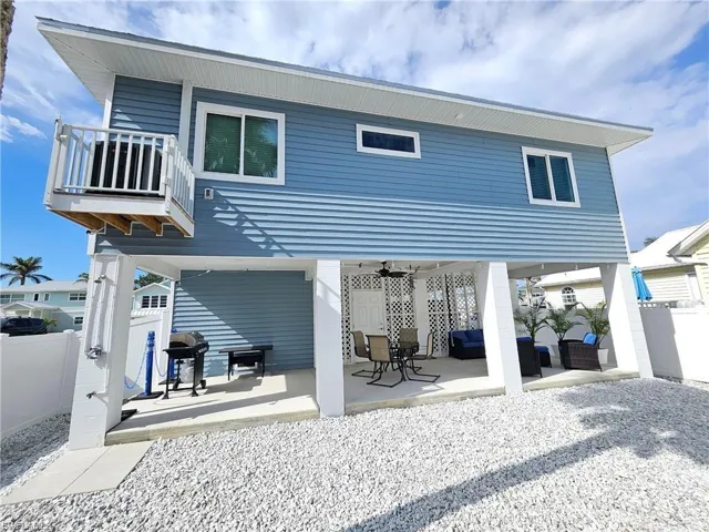 Rear view of house with a patio area, an outdoor hangout area