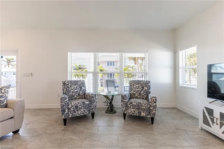 Sitting room featuring baseboards