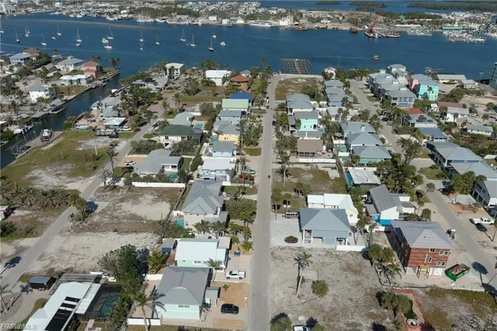 View of property location featuring a nearby body of water and nearby suburban area