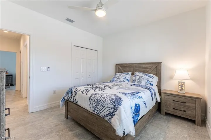 Bedroom featuring a closet and a ceiling fan