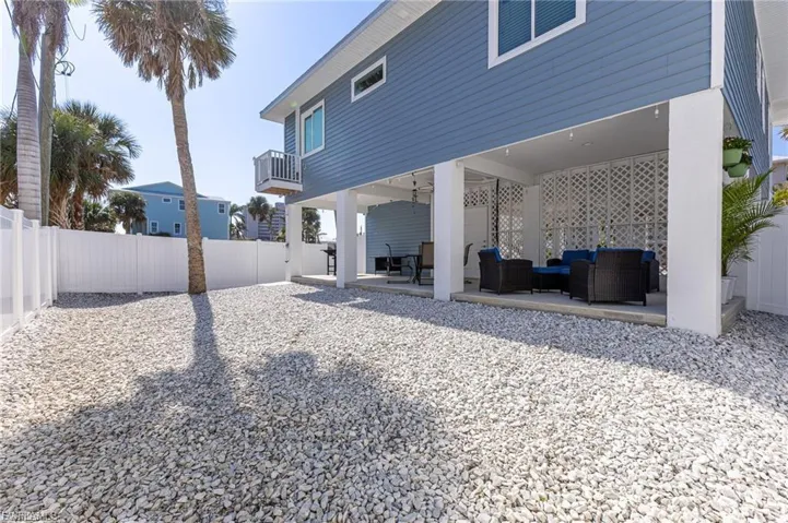 Rear view of house featuring a patio area, a fenced backyard, outdoor lounge area