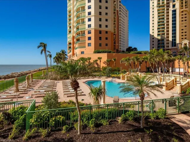 View of pool featuring a water view and a patio area