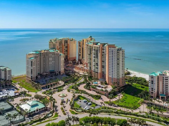 Aerial view featuring a view of the beach and a water view