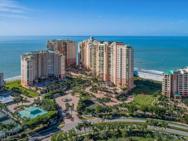Bird's eye view featuring a beach view and a water view