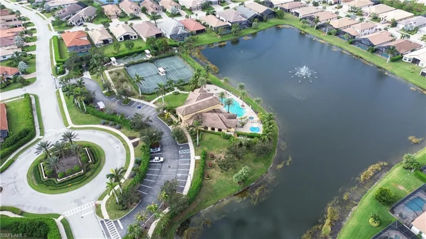 Aerial overview of property's location featuring a large body of water and nearby suburban area