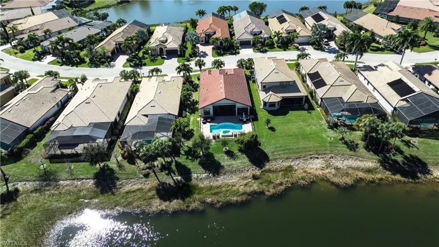 Aerial view of residential area with a nearby body of water