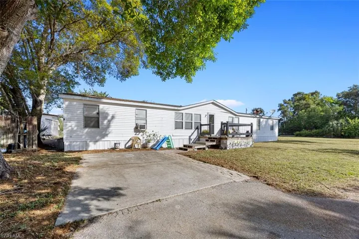 Front of house featuring a wooden deck