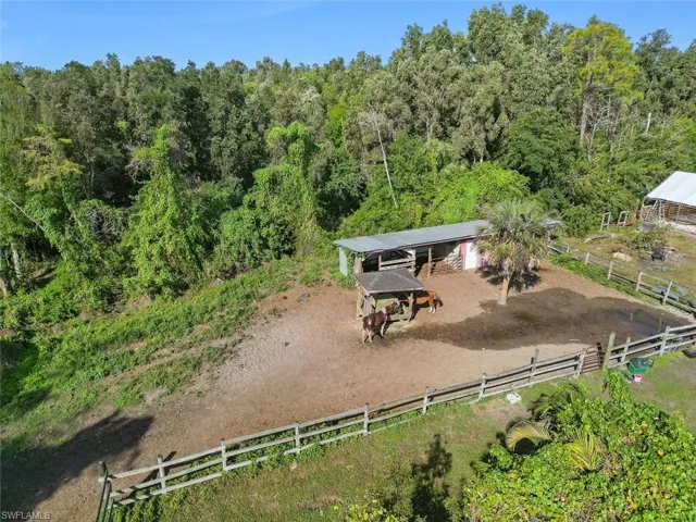 Birds eye view of property featuring a rural view