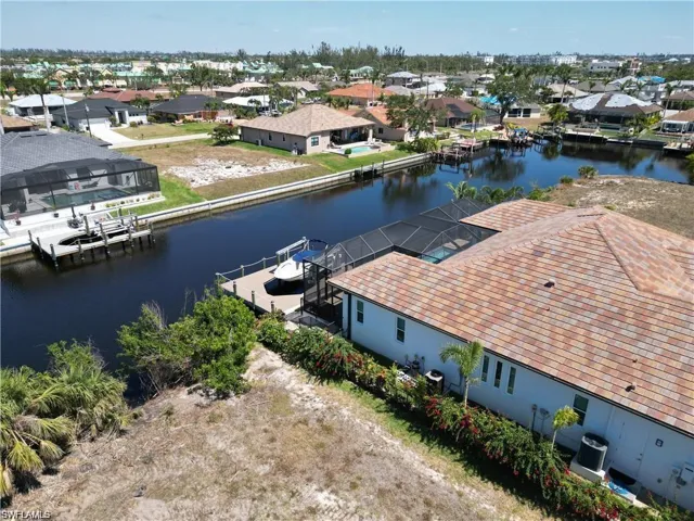 Aerial view of residential area with a nearby body of water