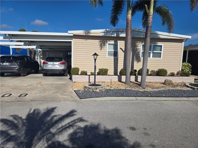 View of front of home featuring a carport