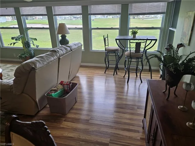 Living room featuring dark wood-type flooring