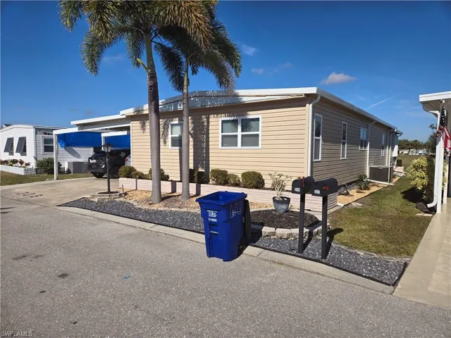 Manufactured / mobile home with central AC and a carport