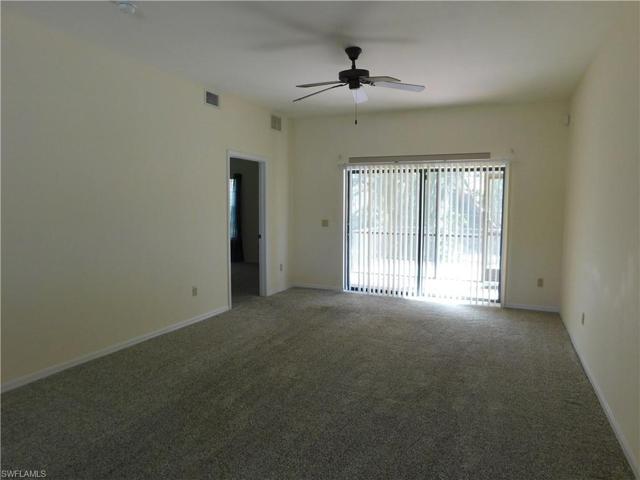 Great room living area with sliders to screened lanai.