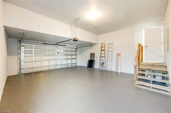 Garage featuring a garage door opener