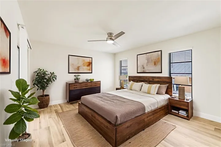 Bedroom featuring light wood finished floors and ceiling fan