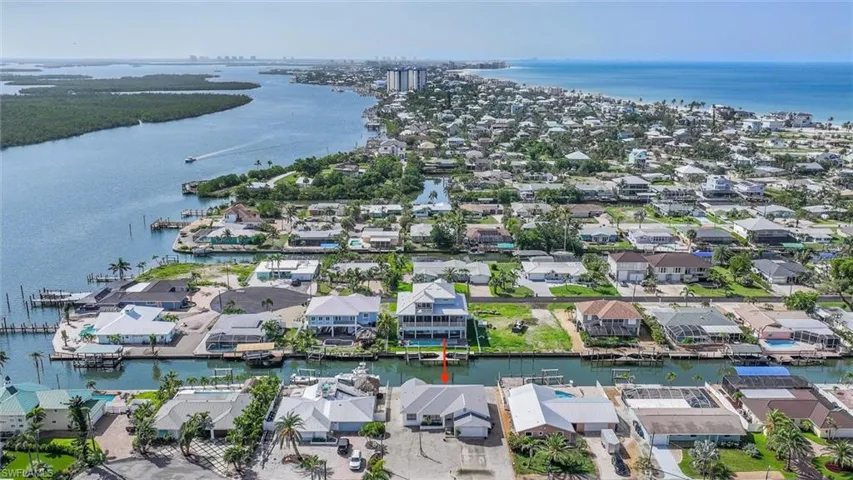 Aerial view of residential area with a nearby body of water