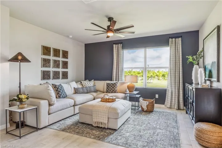 Living room and light hardwood / wood-style flooring