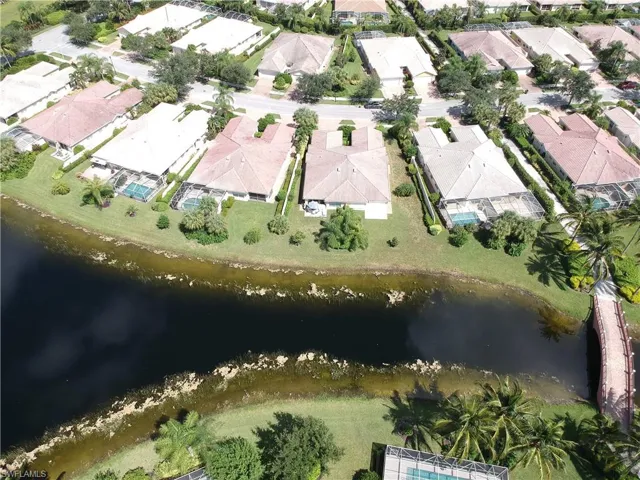 Waterfront properties featuring private screened pools and mature landscaping