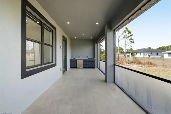 Balcony with a sunroom and a sink