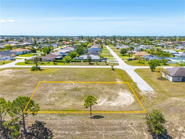 Aerial view of residential area featuring property boundaries highlighted
