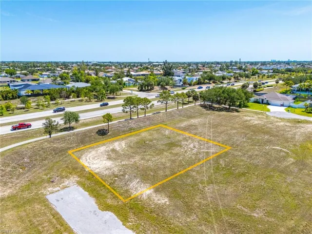 Aerial view of residential area with property parcel outlined