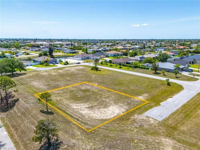 Aerial view of residential area with property parcel outlined