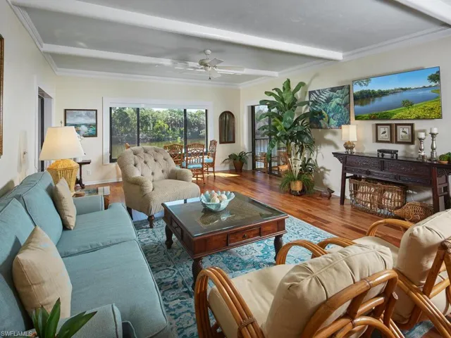 Large living room with adjoining lanai overlooking the lake.
