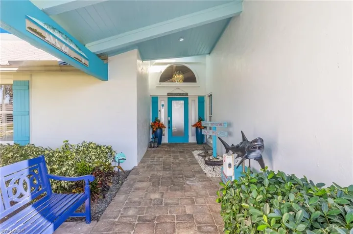 View of exterior entry featuring stucco siding
