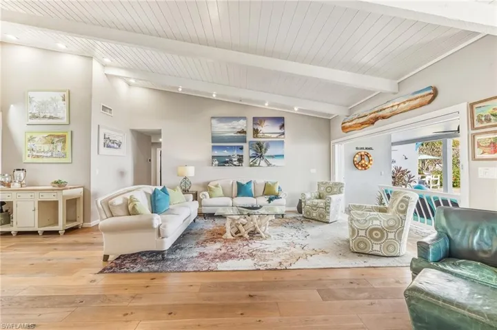 Living area featuring light wood-style floors and wood ceiling