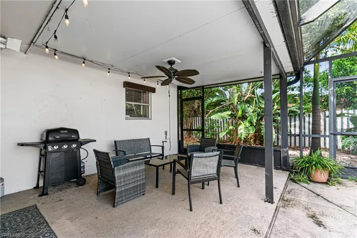 View of patio featuring ceiling fan and a grill