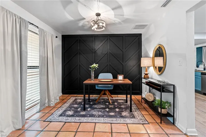 Tiled office space with sink