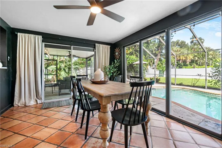 Tiled dining space with ceiling fan