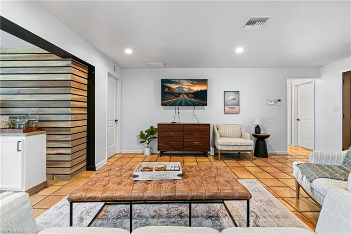Living room featuring light tile patterned flooring