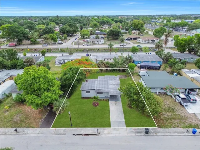 View of home with long driveway