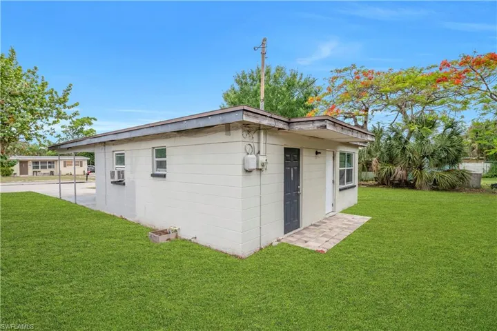 View of side of home and back yard