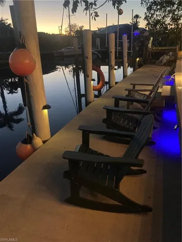Dock area with a water view and boat lift