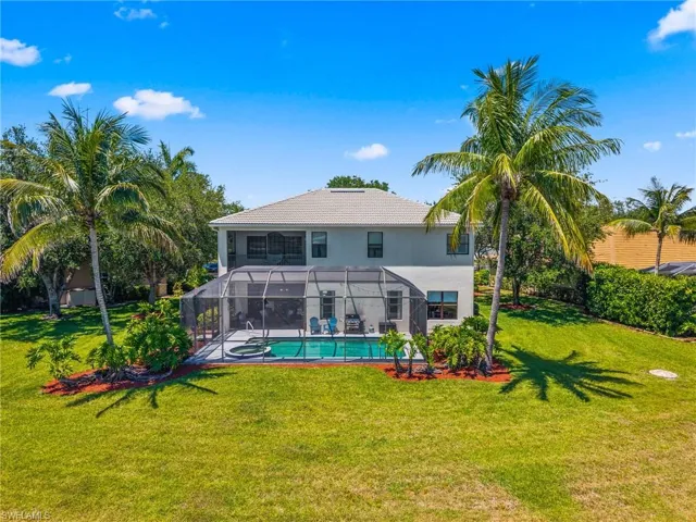 Tile Roof with newly painted exterior in 2023- fire pit in east location of backyard with lush landscape for privacy