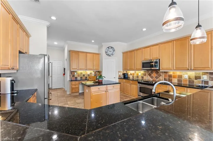 A chefs delight with lots of counter space and cabinetry to entertain.