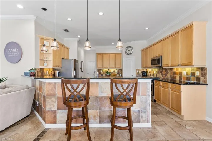 Additional Raised Peninsula Island with additional seating and tiled wall.