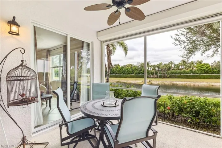 Lanai with a pond view and rolldown shutters.