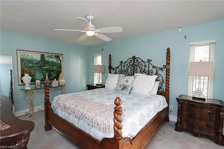 Tiled bedroom with ceiling fan