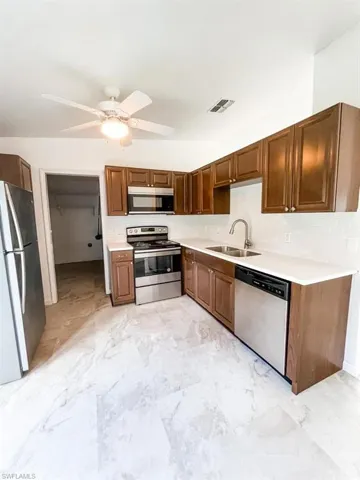 Kitchen Featuring Stainless Steel Appliances