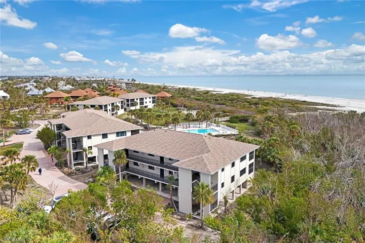 Bird's eye view featuring a water view and a view of the beach