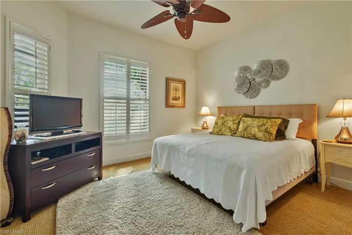 Bedroom featuring ceiling fan and light colored carpet
