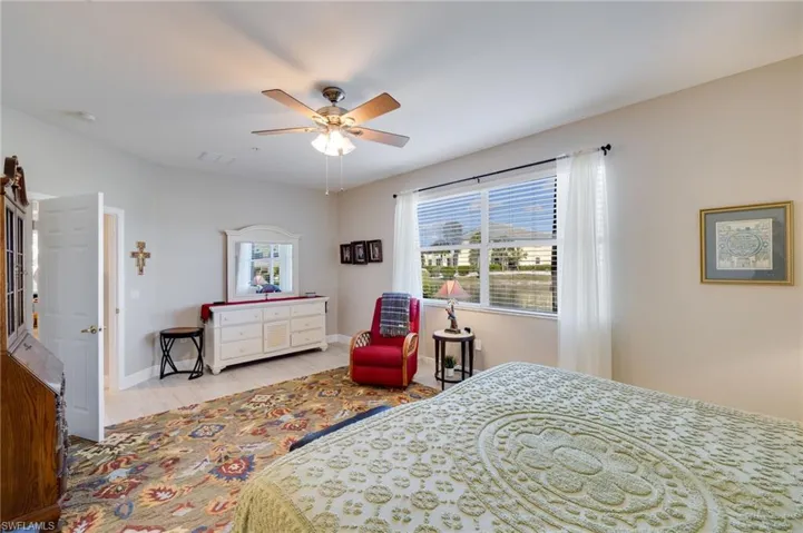 Bedroom with wood finished floors and a ceiling fan