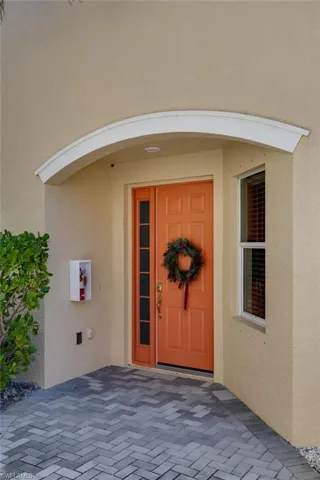 Entrance to property featuring stucco siding