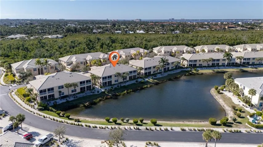 Aerial overview of property's location featuring a large body of water