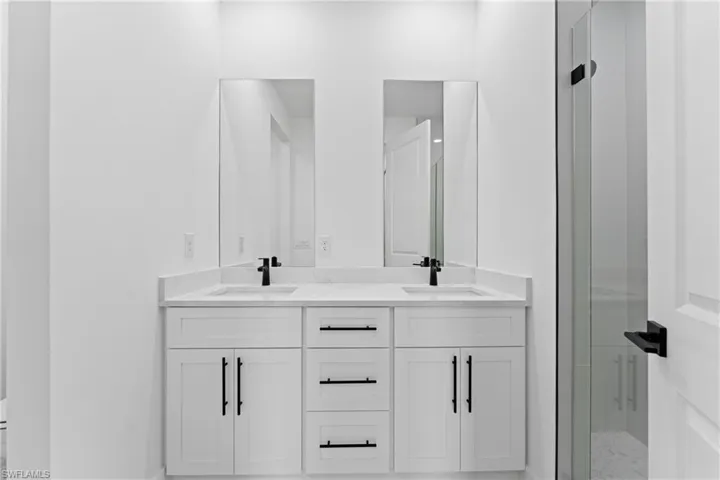 Bathroom featuring vanity and walk in shower