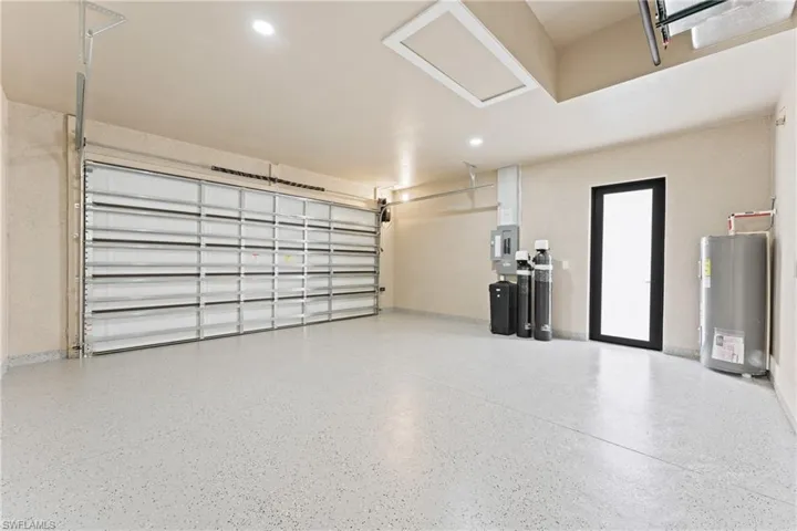 Garage featuring water heater