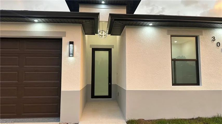 Property entrance featuring a garage